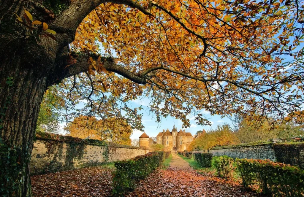 Ratilly castle under the autumn foliage