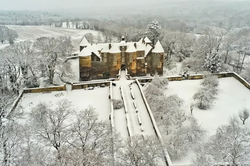 Aerial view of Ratilly castle in winter with snow