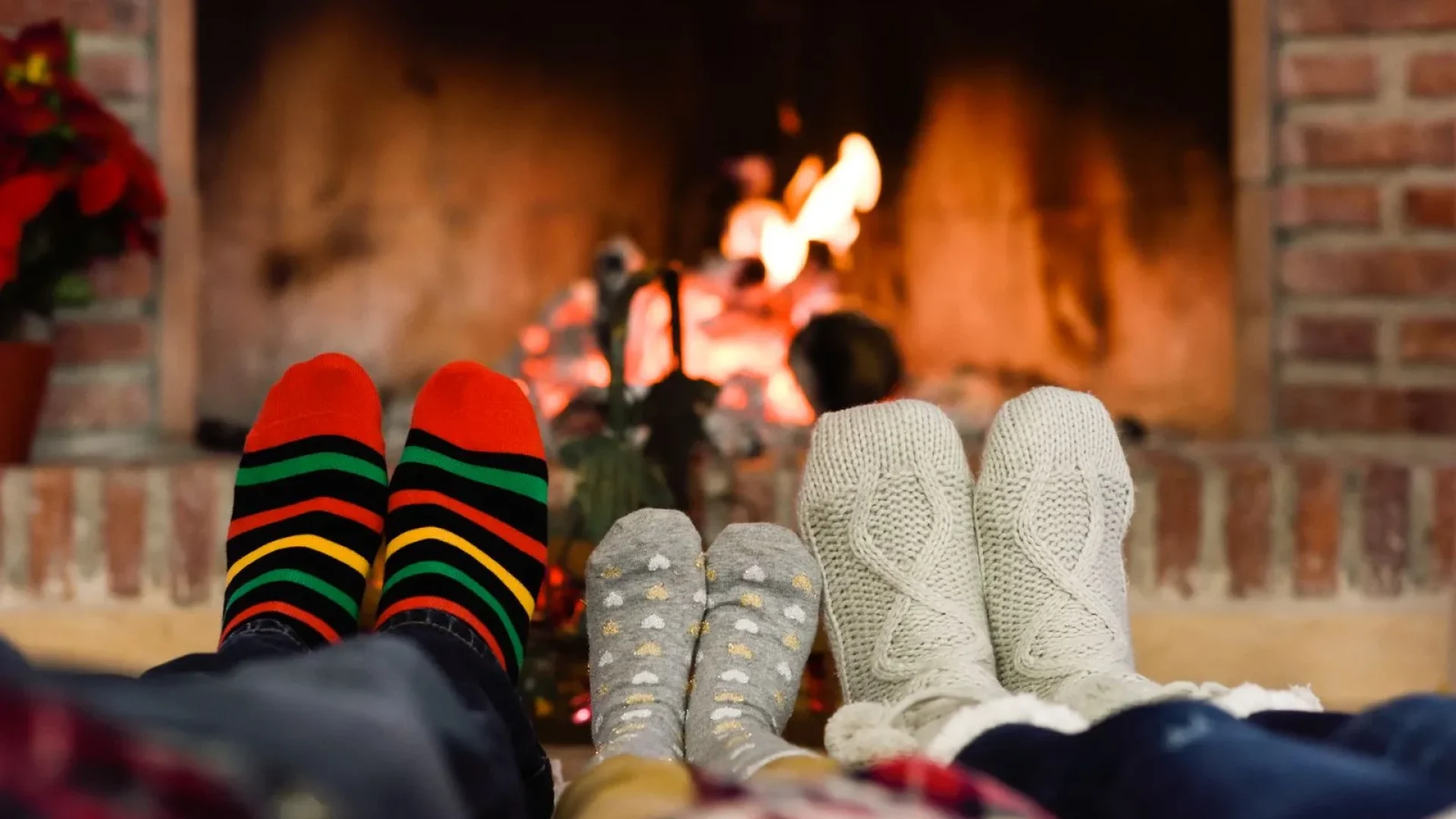 family in front of the fireplace in winter