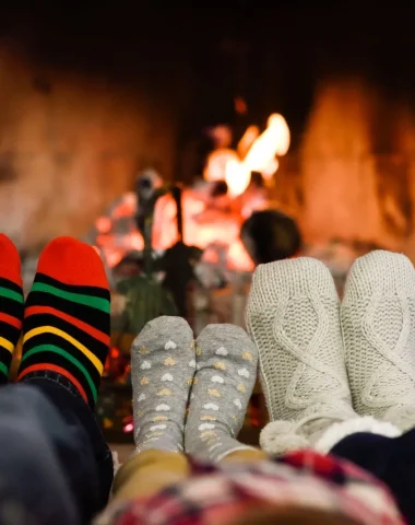 family in front of the fireplace in winter